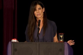 Sandra Bullock, navy dress, necklace, podium